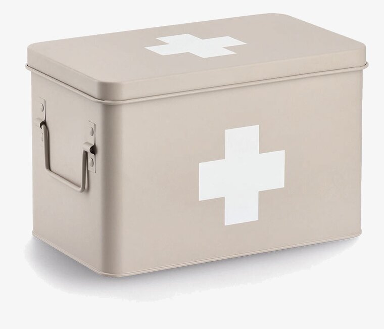 Bild av beige medicinburk med vitt kors och handtag